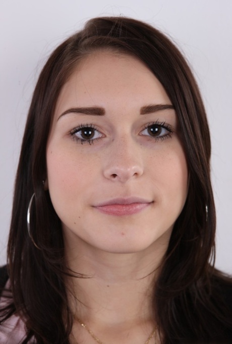 Young amateur Zuzana strips jeans and panties to stand naked for the camera