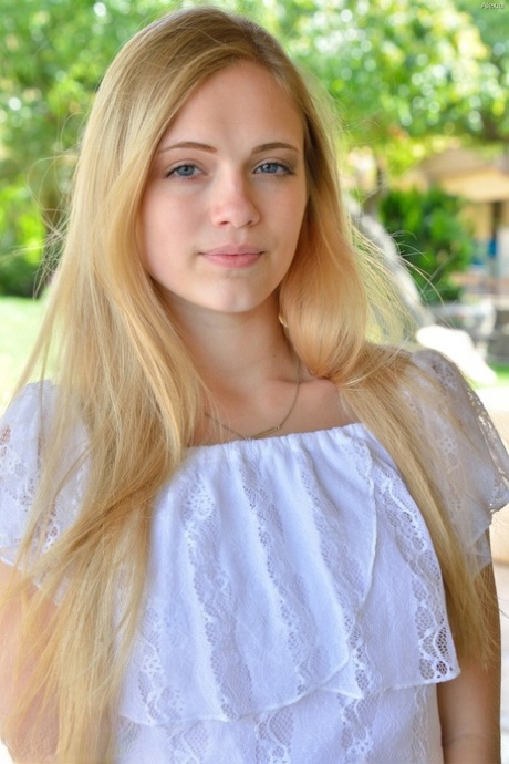 Cute teen takes off her clothes and goes for a naked walk down the road