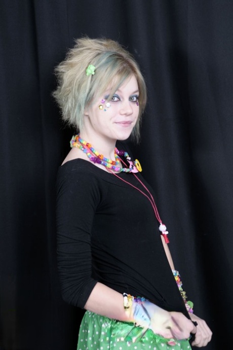 Teen raver Seattle sets her small tits free in solo action