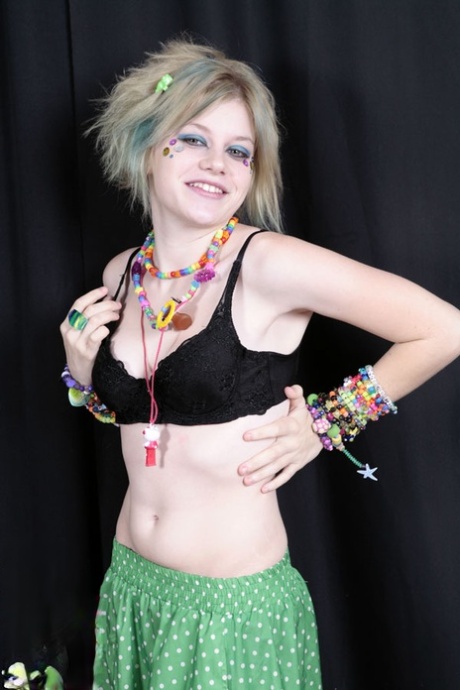 Teen raver Seattle sets her small tits free in solo action