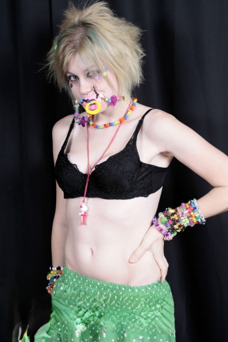 Teen raver Seattle sets her small tits free in solo action