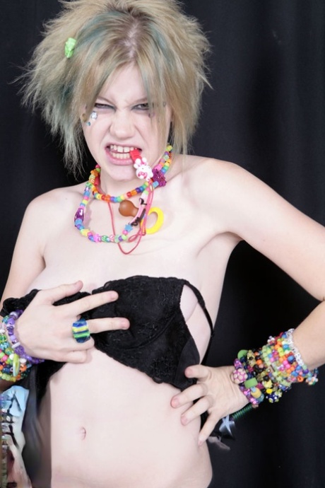 Teen raver Seattle sets her small tits free in solo action