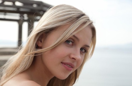 Young bolnde Luciana A boldly flashes a naked upskirt on the balcony
