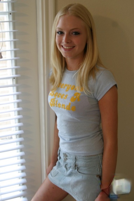 Blonde amateur Skye Model models by herself in a short skirt