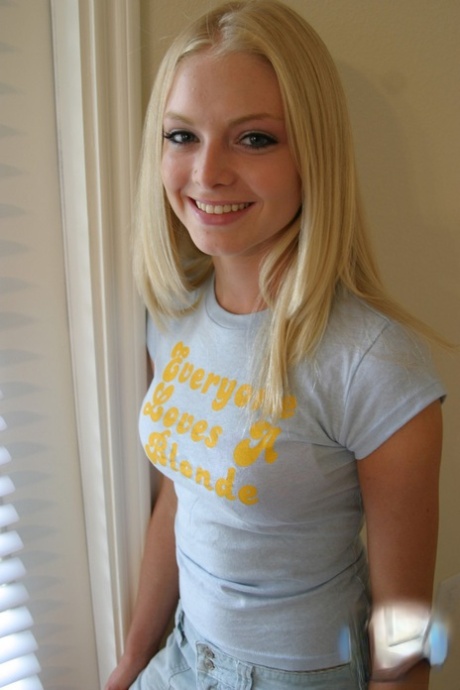 Blonde amateur Skye Model models by herself in a short skirt