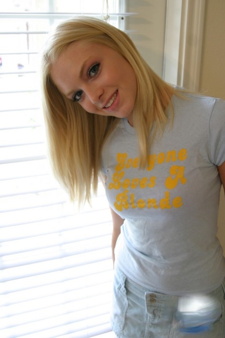 Blonde amateur Skye Model models by herself in a short skirt