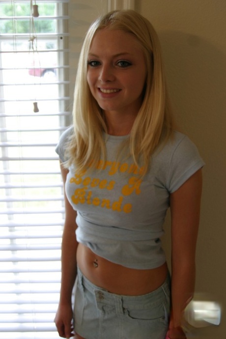 Blonde amateur Skye Model models by herself in a short skirt