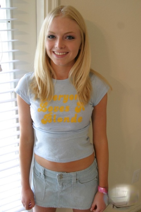 Blonde amateur Skye Model models by herself in a short skirt