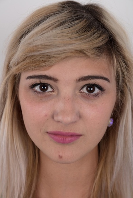 Teen Karolina hopes to break into porn by peeling her short skirt to pose nude