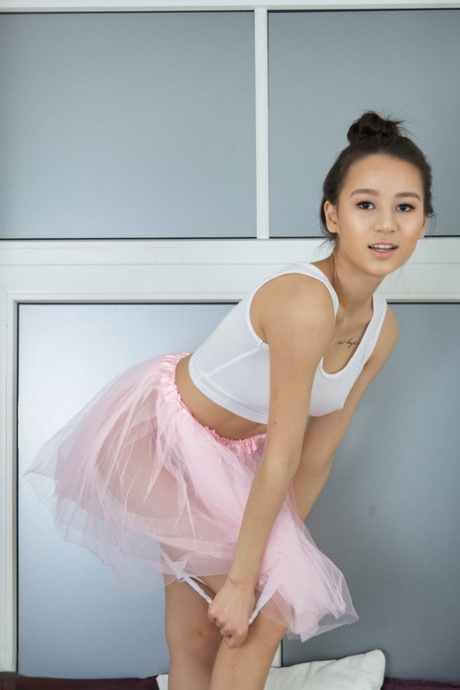 Flexible amateur Elisia removes tutu and sock to model totally naked