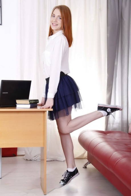 Young redhead does the splits in canvas sneakers while fucking her old teacher