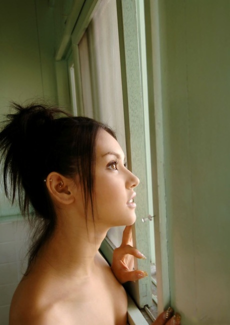 Japanese model Maria Ozawa enjoys a beverage after stripping naked