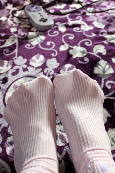 Young girl Andi Land slides her underwear aside while gaming in OTK socks