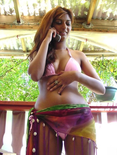Indian teen releases her firm tits and a pierced nipple from her bikini top