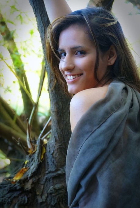 Nice teen Aranxa gets butt naked after climbing up in a tree