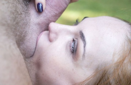 Young redhead Red Linx kisses an old man before they fuck on the lawn
