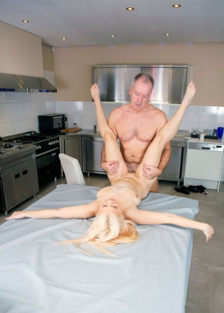 Blond teen Roxy Risingstar and an old man have sexual intercourse in a kitchen