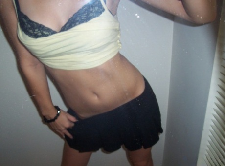 Blonde amateur Kylie takes off her brassiere in a tempting fashion