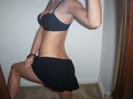 Blonde amateur Kylie takes off her brassiere in a tempting fashion