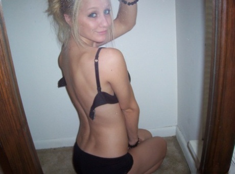 Blonde amateur Kylie takes off her brassiere in a tempting fashion