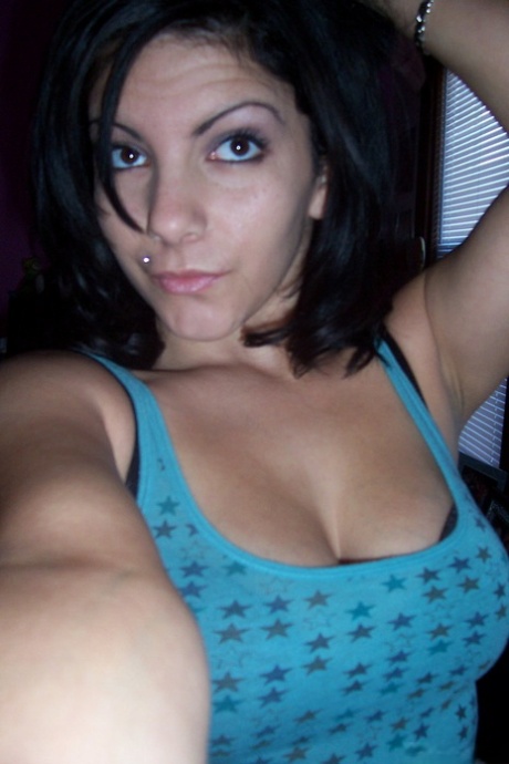 Brunette teen Nikki takes tempting safe for work self shots while undressing