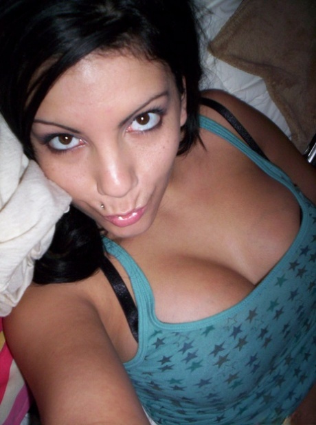Brunette teen Nikki takes tempting safe for work self shots while undressing