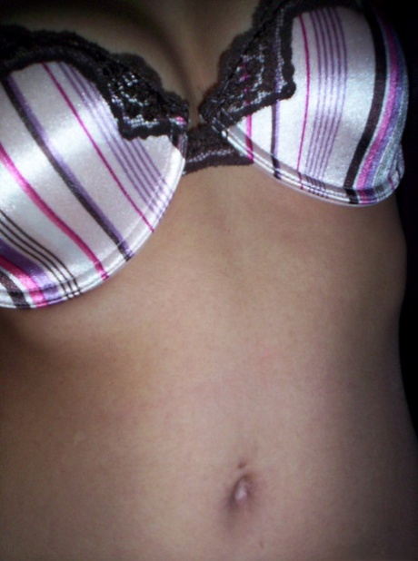 Brunette teen Nikki takes tempting safe for work self shots while undressing