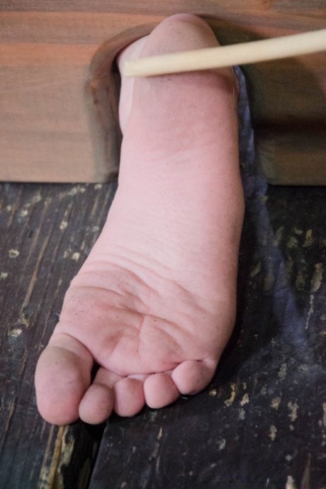 Naked female is restrained and humiliated before forced masturbation