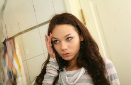 Slender teen with long hair and her boyfriend fuck in the shower