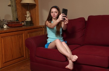 Teen amateur Myra Glasford takes a selfie before masturbating with toys