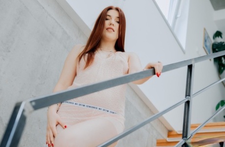 Pale redhead Mia Evans displays her beautiful body during a finger fuck