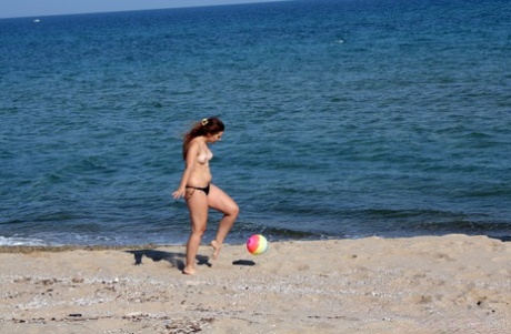 2 young looking girls masturbate after going topless at the beach