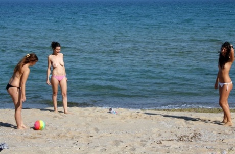 2 young looking girls masturbate after going topless at the beach