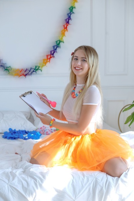 Sweet blonde teen Dema gets totally naked in a playful manner