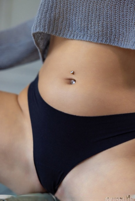 Beautiful teen Jane Devis gets totally naked in an inviting manner