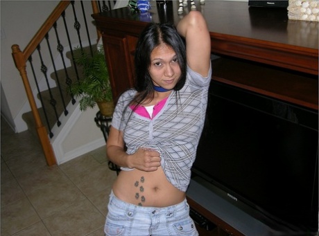 Indian teen wears a choker while undressing for her first nude poses