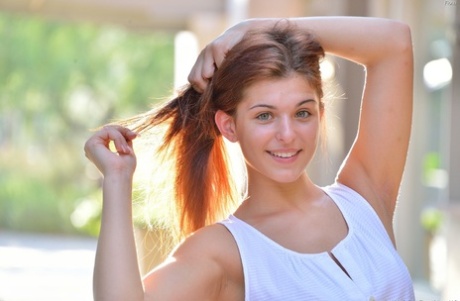Hot redhead teen loves fingering her orgasmic pussy in public