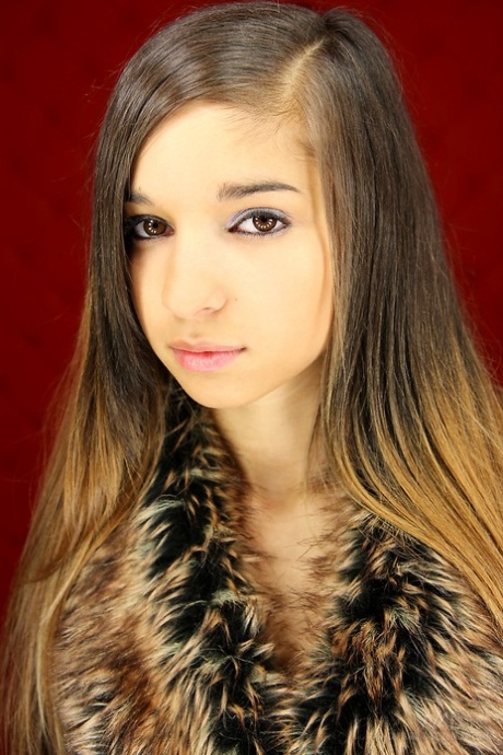 Innocent young girl Nika slowly takes off her clothes to pose in birthday suit