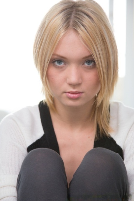 Frisky teenie with smoky eyes revealing her small titties and pussy