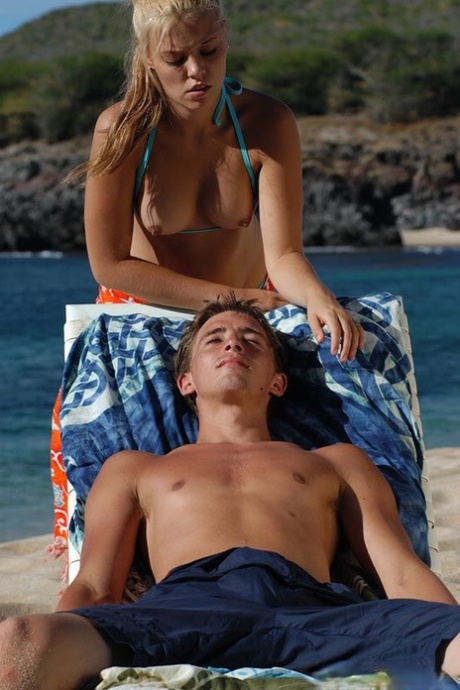 Sultry blondie with perky titties gives head and gets fucked on the beach