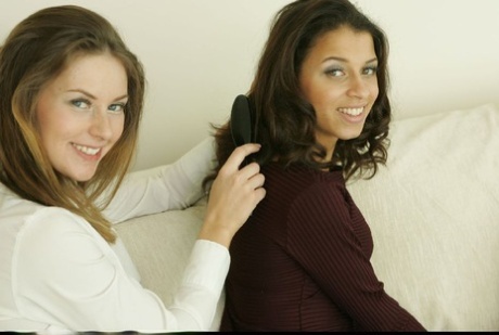 Teen lesbians kissing each other and uncovering their tempting bodies
