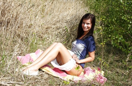 Leggy teenage sweetie strips and has some fun with her glass toy outdoor
