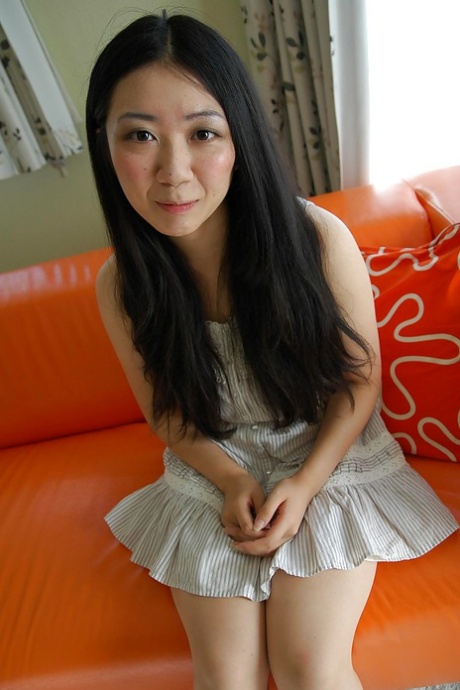 Asian teen Jun Matsubara undressing and spreading her lower lips