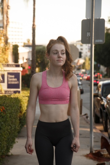 Teenage athlete Julie Wheeler working out in a sexy pink top and gym tights