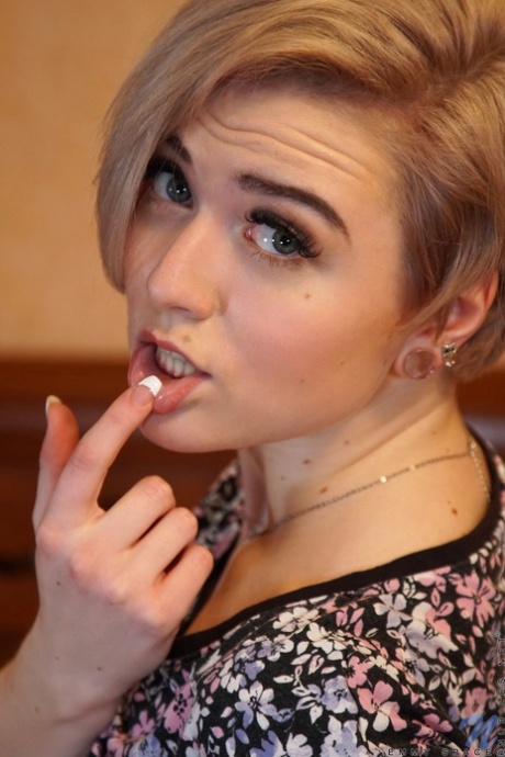 Short haired teen Emmy Space loses her turquoise panties & rubs her pink clit