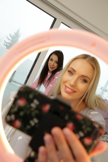 Sexy lesbian teens strip off their pajamas and have intense sex on the bed