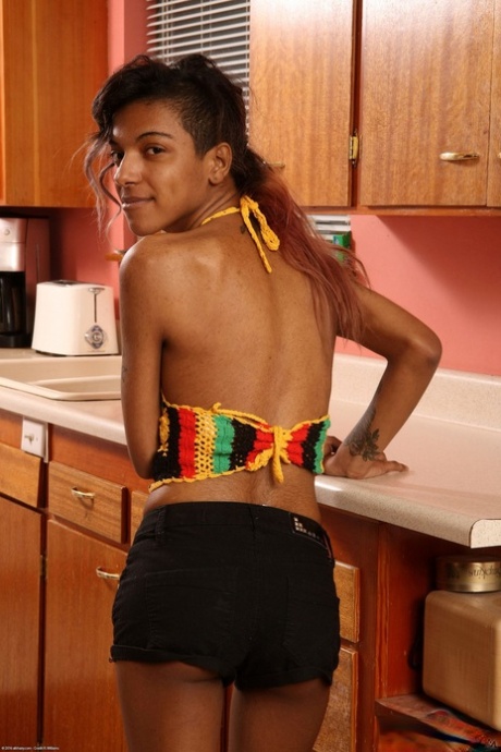 Amateur ebony Yvette gets naked before massaging her tits & hairy twat