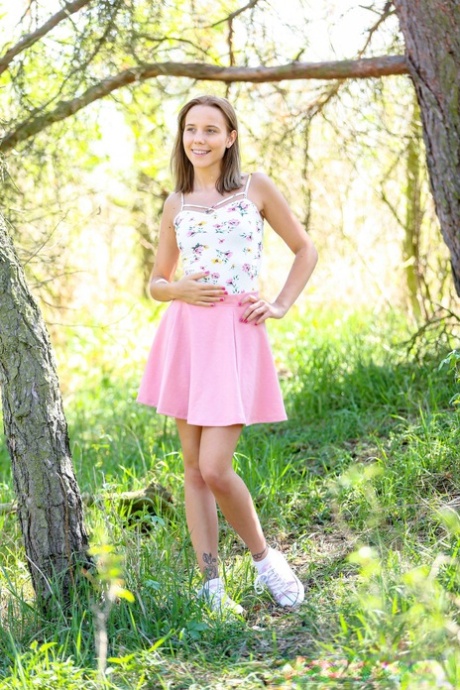 Teenage adventurist Poppy Pleasure strips & masturbates in the forest