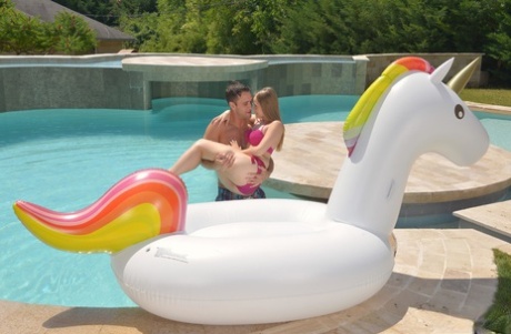Blonde teen Lady Bug bares tiny titties to catch a load in her mouth poolside