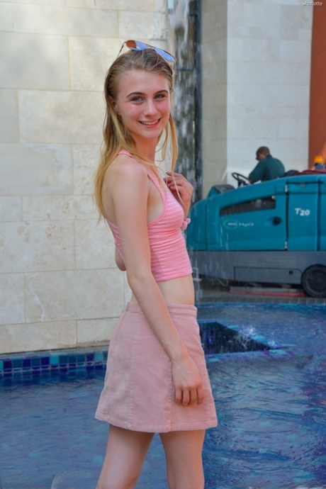 Slim 18 year old Sharlotte flashes her naked pussy in public places